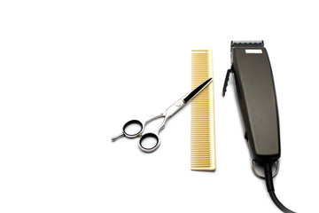 hair clipper comb and scissors isolated on white background