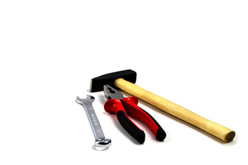 hammer wrench and pliers on a white background