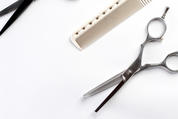 scissors and comb on a white background