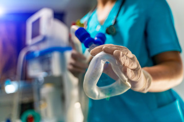 Artificial lung ventilation monitor in the intensive care unit. Nurse with medical equipment....