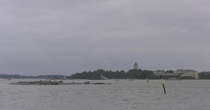 4K Helsinki Baltic Sea Finnish Bay lagoon, yachts, cruise liners view on cloudy summer day video, Luoto Island green park, old beautiful red roof mansion in Finland, northern Europe