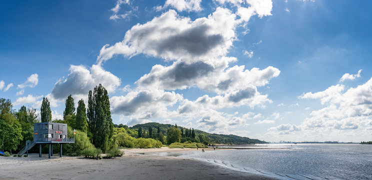 Panorama of a shore area in Hamburg with a beach