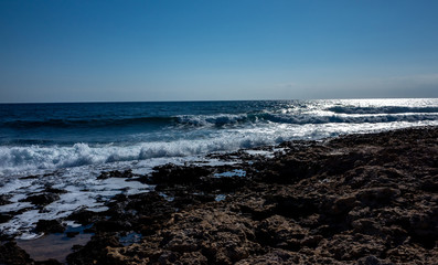 Fototapeta na wymiar Rocky beach on the Mediterranean coast on the Akamas Peninsula on the island of Cyprus.