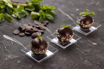 
Buffet menu in disposable utensils from a catering company. On a dark background