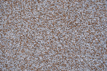 close view of the wall surface, decorative finishing, heat insulation granules or granite particles