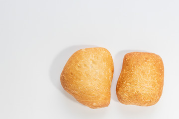 Two rolls of white bread