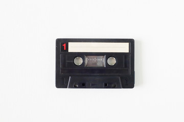 Old tape cassette, old or aged wood background. İsolated casette