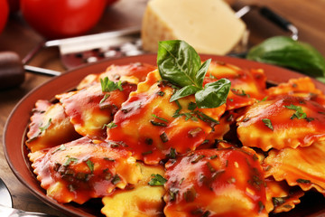 Ravioli with tomato sauce and basil. Fresh homemade ravioli