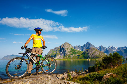 Biking in Norway against picturesque landscape. Bike, active. © Maygutyak