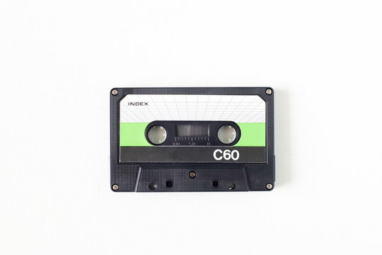Old tape cassette, old or aged wood background. İsolated casette