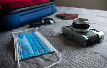 Mask with sunglasses camera and passport for holidays
