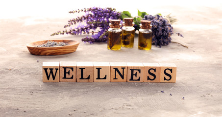 lavender herbal oil and lavender flowers. bottle of lavender massage oil for aromatherapy treatment...