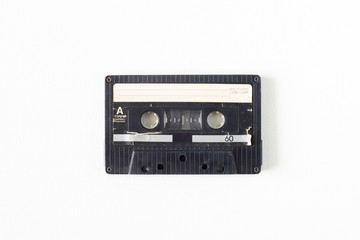 Old tape cassette, old or aged wood background. İsolated casette