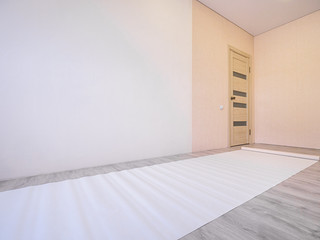 Repairs. A strip of wallpaper lies on the floor throughout the room. Housewarming