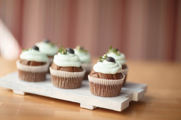 cupcakes with blueberries on the Board