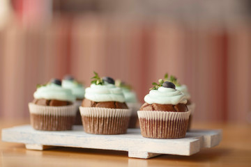 cupcakes with blueberries on the Board