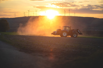 Fototapeta premium Farmer on a tractor, spring sowing, agricultural fields.