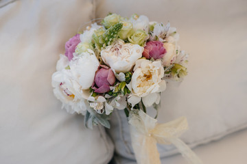A beautiful stylish bouquet stands on the table close-up