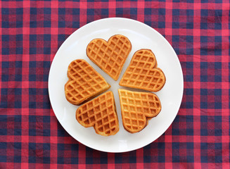 heart-shaped waffles on a white plate