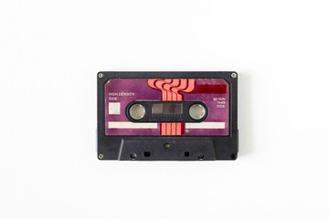 Old tape cassette, old or aged wood background. İsolated casette
