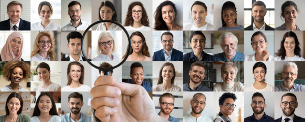 Employer hand holding magnifying glass choosing old middle aged female candidate among young multiethnic professional people faces collage. Human resource, headhunting, senior job opportunity concept. - obrazy, fototapety, plakaty