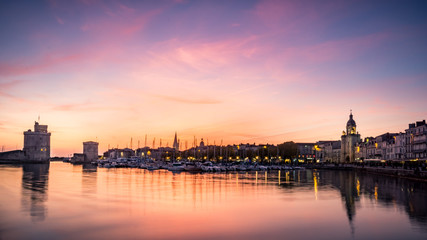 Old harbour of La Rochelle at sunset, the French city and seaport. beautiful colorful  sky and clouds. long exposure photography