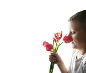 Obraz na płótnie Canvas Boy with bouquet of tulips on isolated background