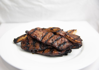 Traditional grilled korean beef on white plate