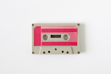 Old tape cassette, old or aged wood background. İsolated casette