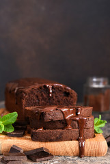 Brownie is a classic American dessert. Chocolate muffin with chocolate sauce and mint.