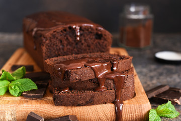 Brownie is a classic American dessert. Chocolate muffin with chocolate sauce and mint.