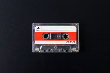 Fototapeta premium Old tape cassette, old or aged wood background. İsolated casette
