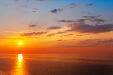Beautiful sunrise over the quiet calm sea.