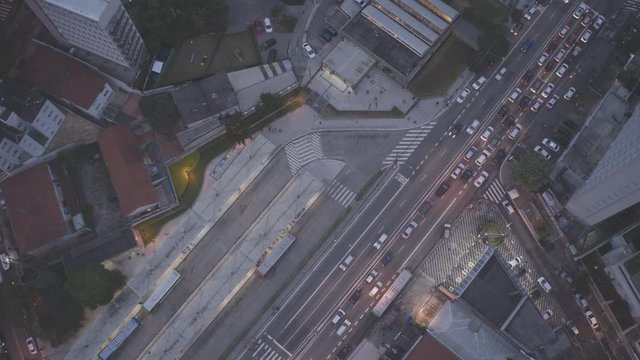 Aerial Hyperlapse of major avenue in Sao Paulo showing transition to dark at sunset feat subway station Metro Vila Madalena