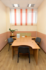 An empty room for business, negotiations, meetings. No people. No one works. Pandemic. Financial crisis. Rental of premises. Orange design.