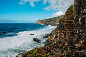 Tropical island of Tenerife. The coast of a Spanish city on the Atlantic ocean. Panorama of the city and beach on the island of Tenerife. Background color with gradient and grain, sound effect.