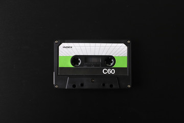 Old tape cassette, old or aged wood background. İsolated casette
