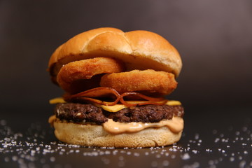 Beef Burger with Meat loafs Salami Pepperoni and Fried Onion Rings Restaurant Menu Image