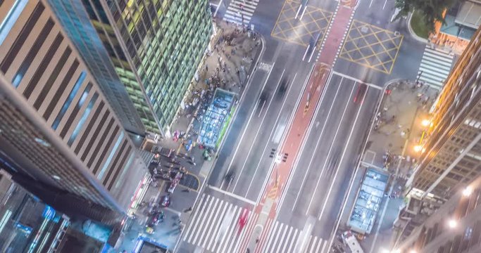 Aerial Hyperlapse of busy early evening at Paulista avenue showing cars and pedestrian traffic in Sao Paulo Brazil