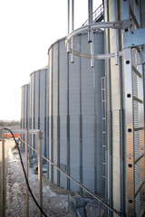 Construction of a feed mill agro-processing plant for processing and silos for drying cleaning and storage of agricultural products, flour, cereals and grain. Close-up.