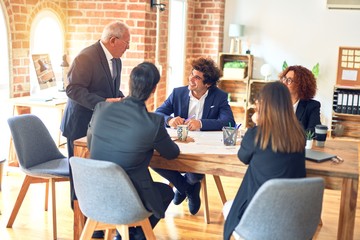 Group of business workers working together in a meeting. Listening one of them speaking at the office.