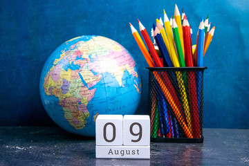 August 9 on the wooden calendar.The ninth day of the summer month, a calendar for the workplace....