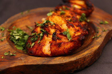 Indian Pakistani Chicken Tikka Piece in a Wooden Bowl