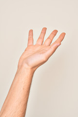 Hand of caucasian young man showing fingers over isolated white background presenting with open palm, reaching for support and help, assistance gesture