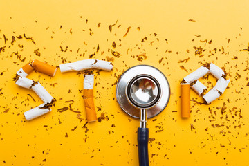 31 May of World No Tobacco Day, no smoking close up word STOP spelled text of the pile cigarette or...