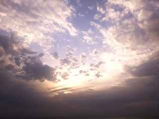 Obraz na płótnie Canvas Low Angle View Of Sunlight Streaming Through Clouds