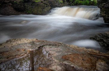 Fototapeta premium Waterfall with tree reflection