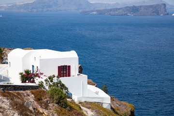 Fototapeta premium traditional white architecture over the Caldera, Aegean sea. Scenic travel background, Santorini