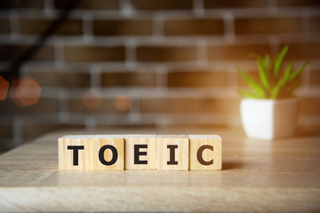Toeic word on wooden cubes. Toeic concept