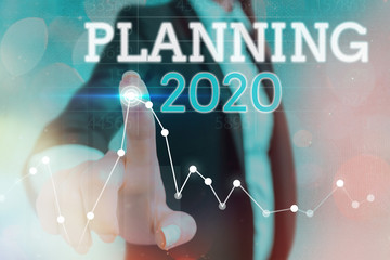 Conceptual hand writing showing Planning 2020. Concept meaning process of making plans for...